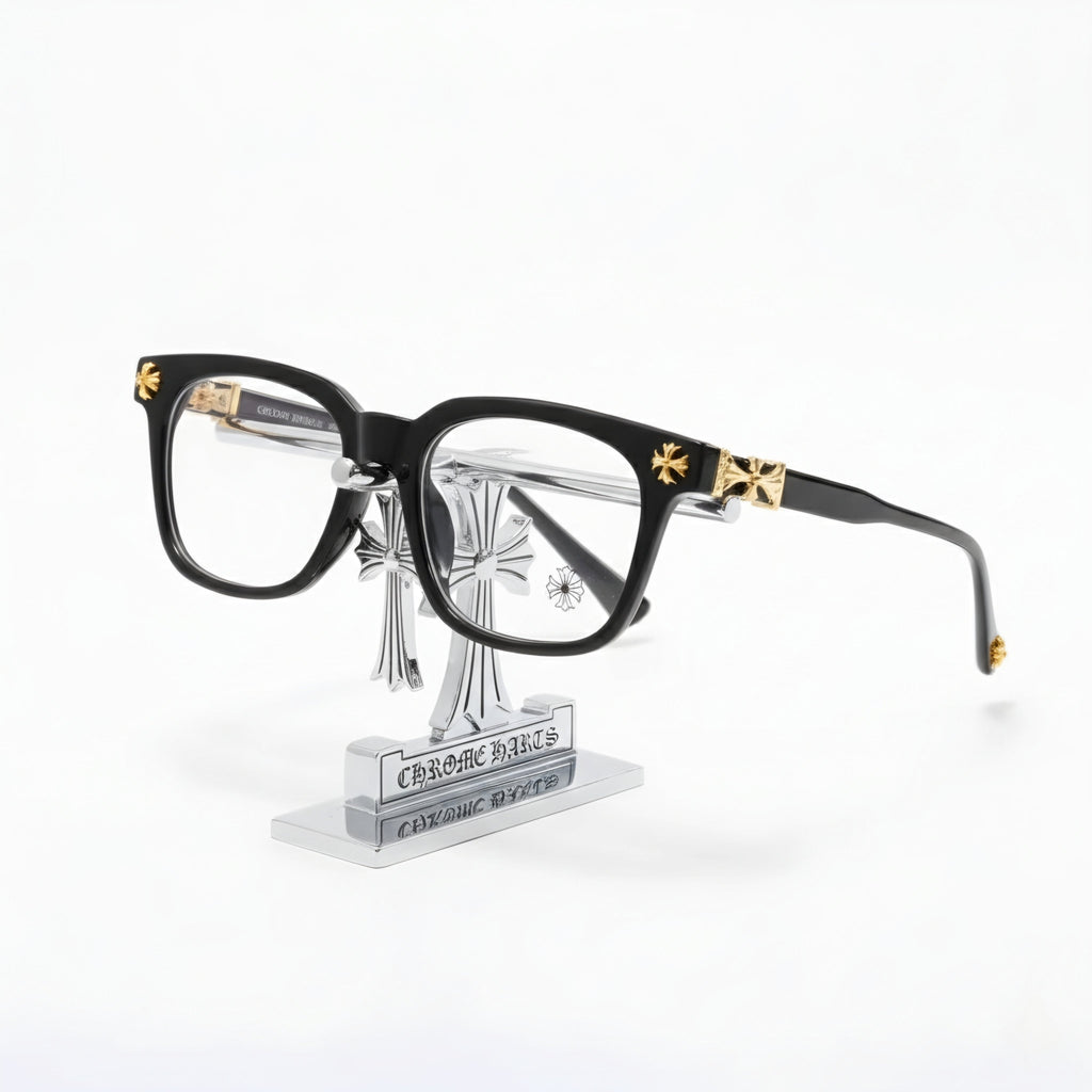 Shadow Gilded Square elegant black glasses with vintage gold-tone hardware on a display stand.