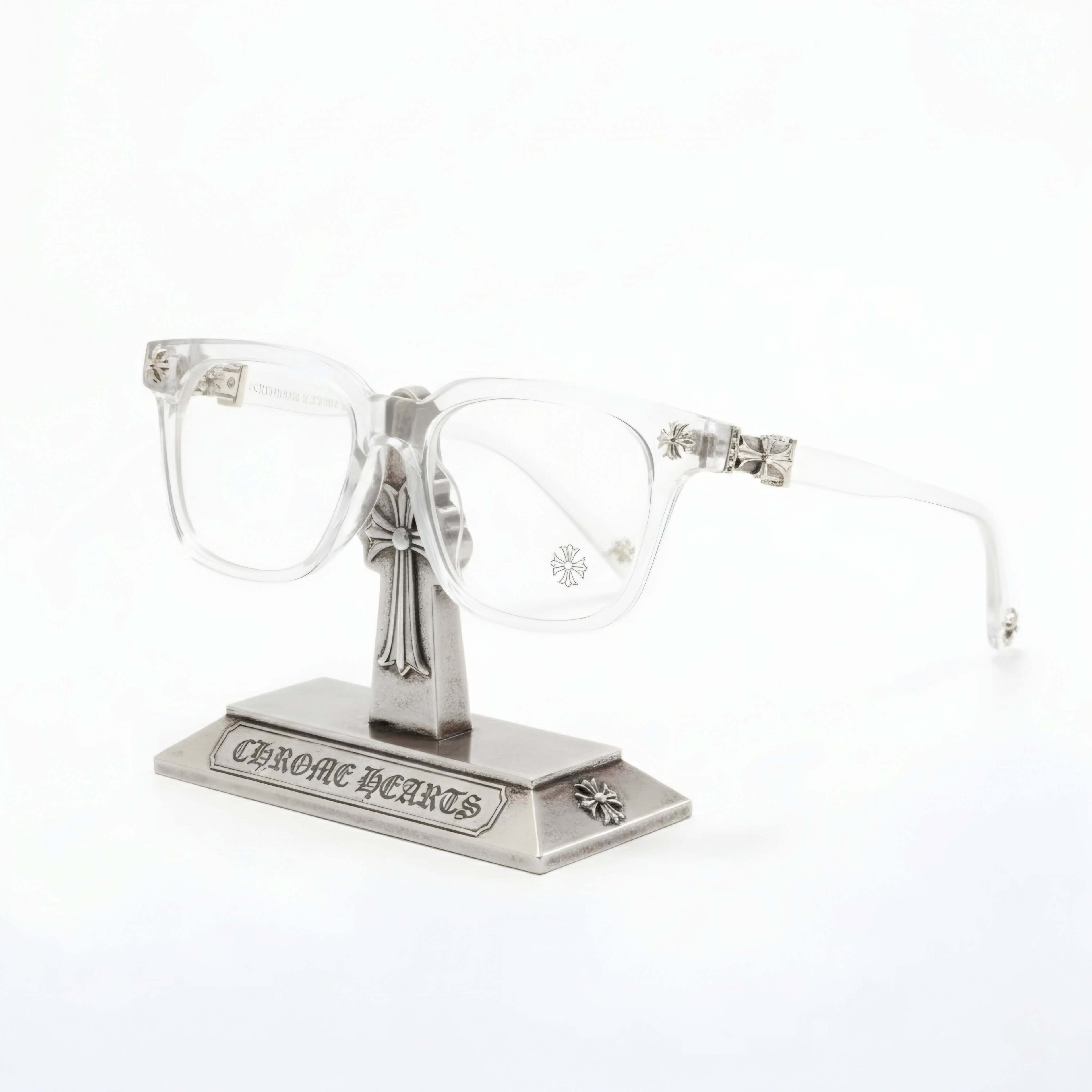 Crystal Chrome Square eyeglasses featuring icy transparency and silver-tone hardware on a display stand.