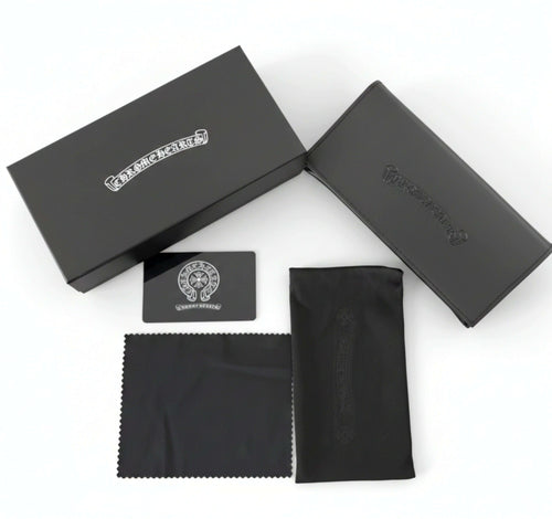 Collector’s Box Set including a protective case, cleaning cloth, and warranty card on a white background.